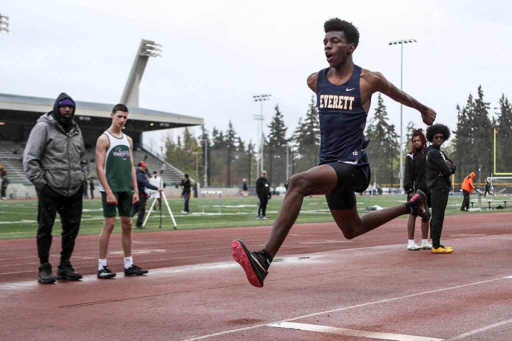 Everetts Shukurani Ndayiragije participates in the triple jump event during a track meet between Lynnwood, Everett, and Edmonds-Woodway at Edmonds District Stadium on Thursday, April 25, 2024 in Edmonds, Washington. (Annie Barker / The Herald)
