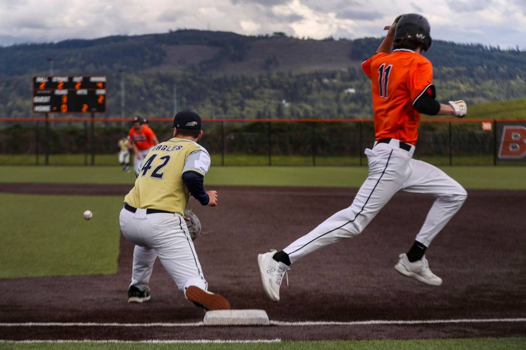 Monroes Caleb Campbell (11) runs through first during a baseball game between Monroe and Arlington at Monroe High School on Friday, April 26, 2024 in Monroe, Washington. Monroe secured a win in an eighth inning, 4-3. (Annie Barker / The Herald)