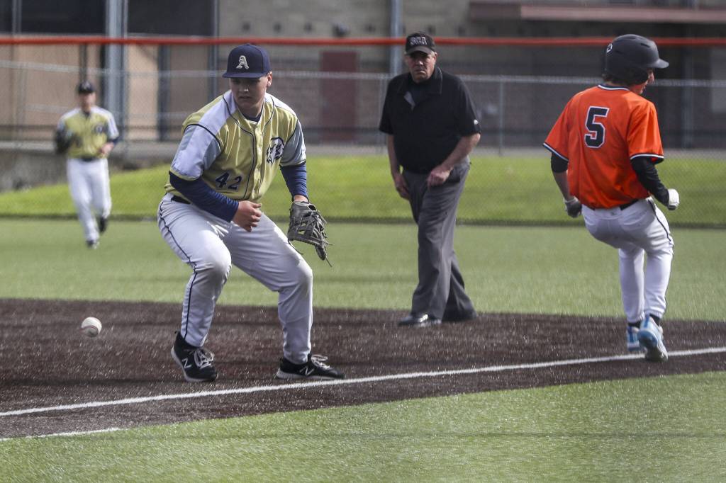 Arlingtons Eli Jones (42) drops the ball during a baseball game between Monroe and Arlington at Monroe High School on Friday, April 26, 2024 in Monroe, Washington. Monroe secured a win in an eighth inning, 4-3. (Annie Barker / The Herald)