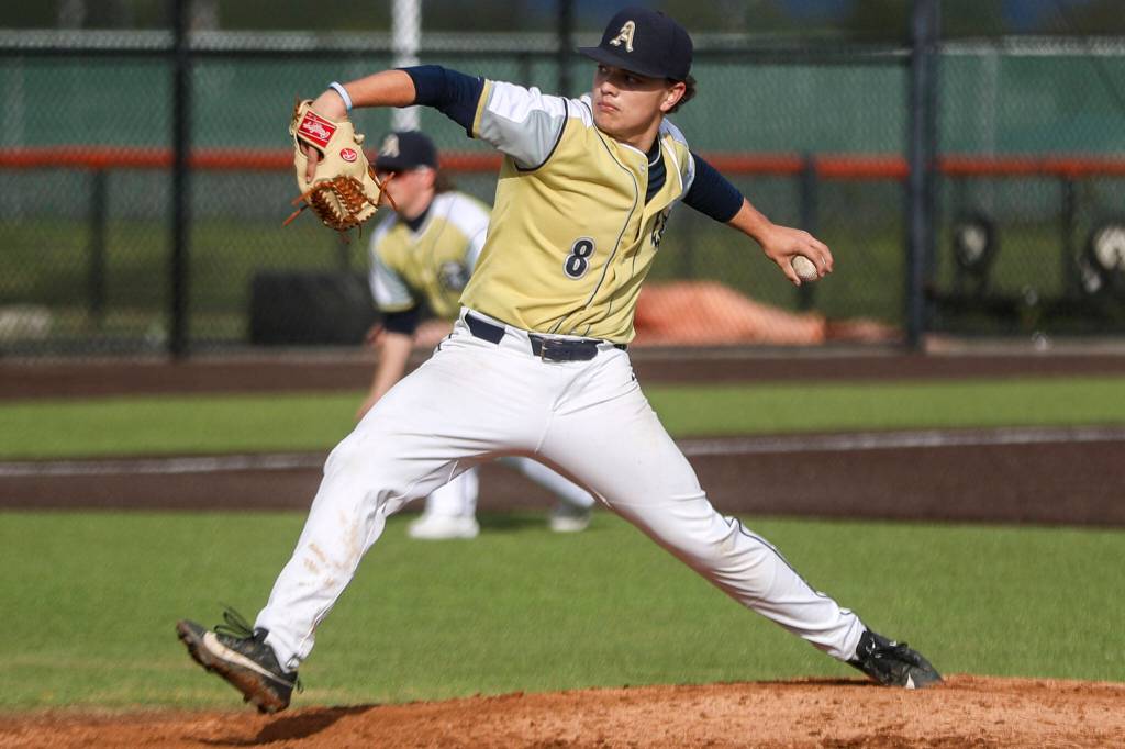 Arlingtons Aiden Jones (8) pitches during a baseball game between Monroe and Arlington at Monroe High School on Friday, April 26, 2024 in Monroe, Washington. Monroe secured a win in an eighth inning, 4-3. (Annie Barker / The Herald)
