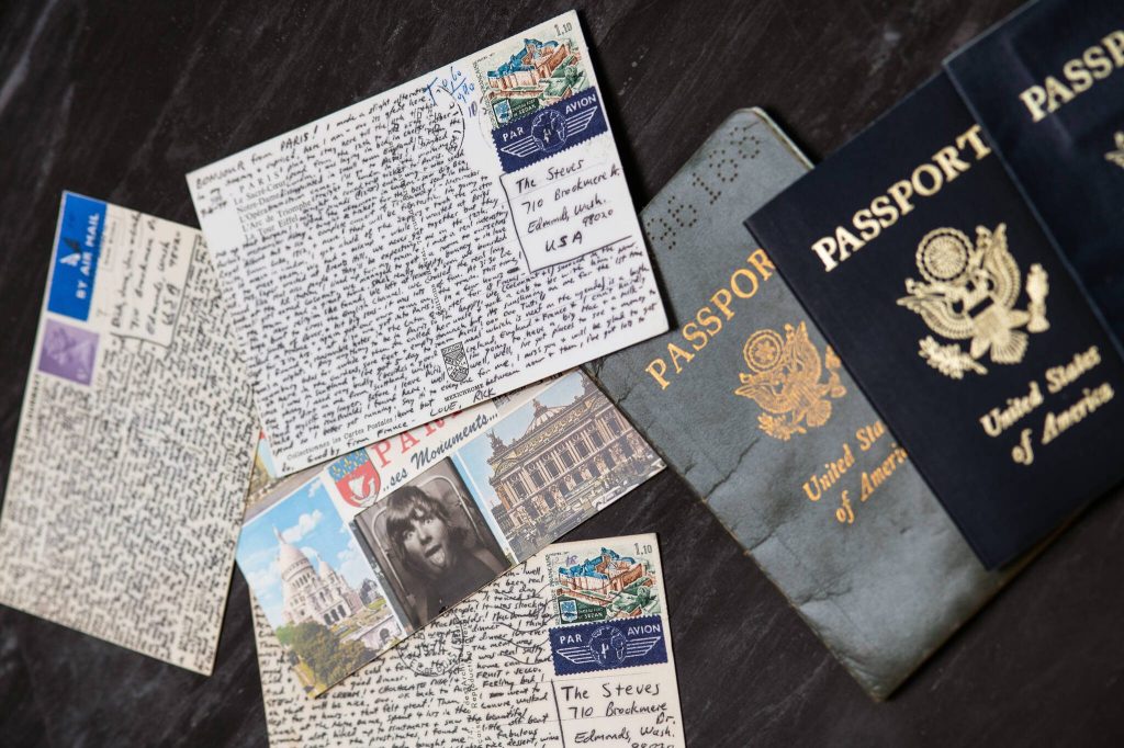 Stevess old passports and intricately detailed postcards sent home from early European travel journeys as a young adult line his living room coffee table. (Daniel Berman for The Washington Post)