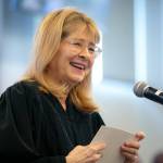 Retired Snohomish County Superior Court Judge Anita Farris smiles as she speaks to a large crowd during the swearing-in of her replacement on the bench, Judge Whitney M. Rivera, on Thursday, May 9, 2024, at Snohomish County Superior Court in Everett, Washington. (Ryan Berry / The Herald)