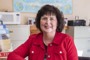 Penny Clark, owner of Travel Time of Everett Inc., at her home office on Tuesday, April 23, 2024 in Arlington, Washington. (Olivia Vanni / The Herald)