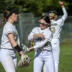 Marysville Getchell players huddle during a softball game between Meadowdale and Marysville Getchell on Wednesday, May 1, 2024 in Marysville, Washington. Meadowdale won, 12-9. (Annie Barker / The Herald)