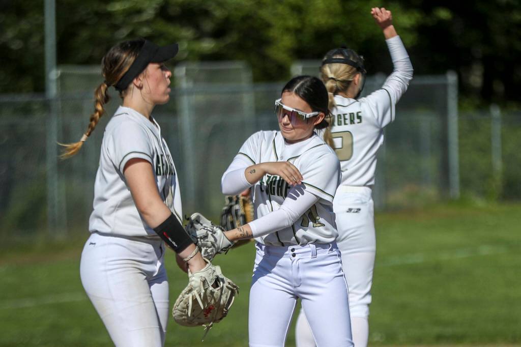Marysville Getchell players huddle during a softball game between Meadowdale and Marysville Getchell on Wednesday, May 1, 2024 in Marysville, Washington. Meadowdale won, 12-9. (Annie Barker / The Herald)