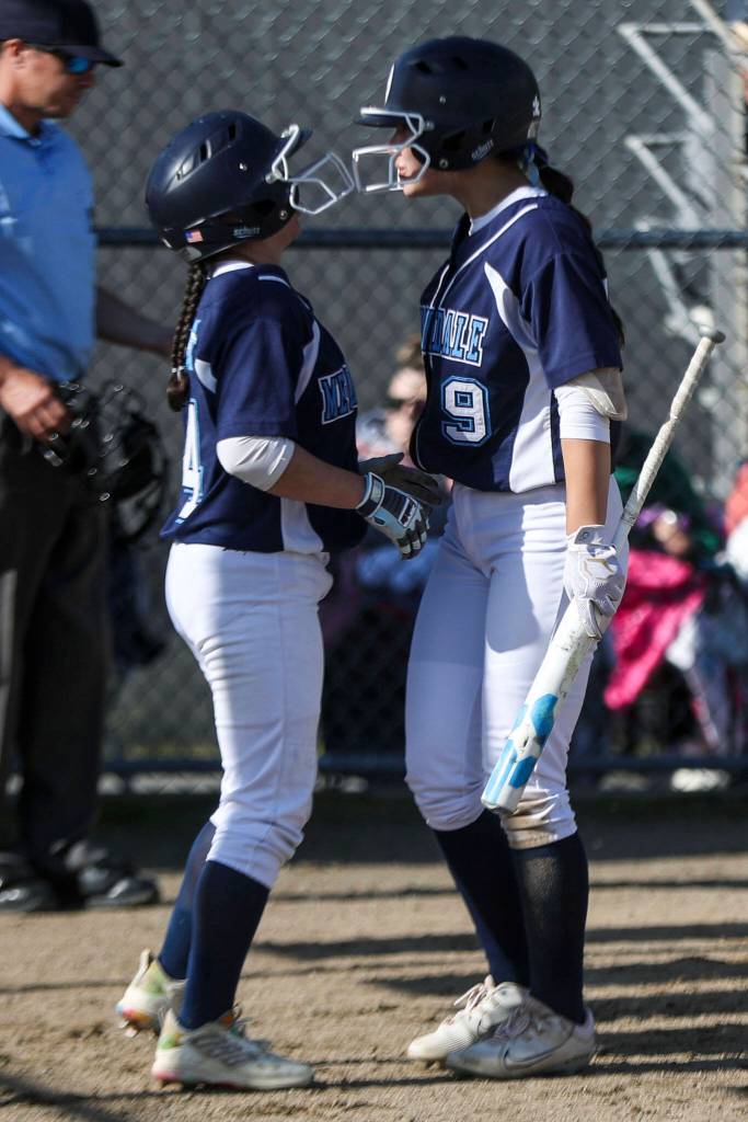 Meadowdale players react during a softball game between Meadowdale and Marysville Getchell on Wednesday, May 1, 2024 in Marysville, Washington. Meadowdale won, 12-9. (Annie Barker / The Herald)