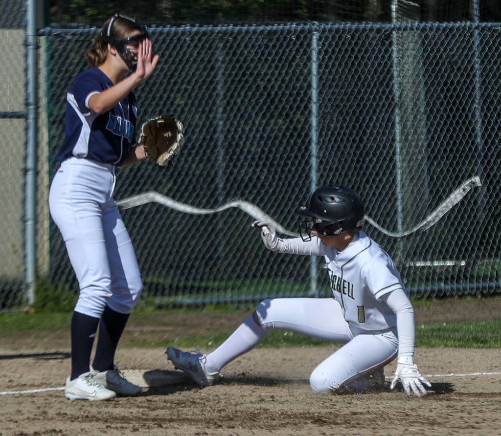 Marysville Getchells Jaidyn Swanson (1) slides into third during a softball game between Meadowdale and Marysville Getchell on Wednesday, May 1, 2024 in Marysville, Washington. Meadowdale won, 12-9. (Annie Barker / The Herald)
