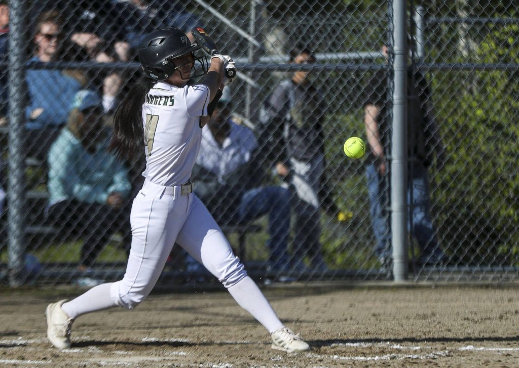 Marysville Getchells Lilyana Balgos (4) swings during a softball game between Meadowdale and Marysville Getchell on Wednesday, May 1, 2024 in Marysville, Washington. Meadowdale won, 12-9. (Annie Barker / The Herald)