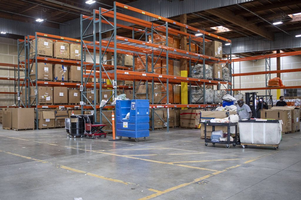 Workers sort recycling at the Ridwell Seattle headquarters in Seattle, Washington on May 6, 2024. (Annie Barker / The Herald)