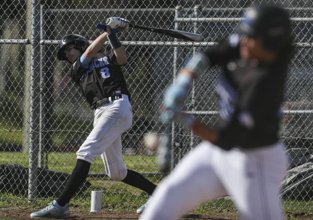 Meadowdales Nicholas Zardis (8) warms up during a District 1 3A baseball game between Meadowdale and Snohomish at Snohomish High School on Monday, April 30, 2024 in Snohomish, Washington. Snohomish won, 3-1. (Annie Barker / The Herald)