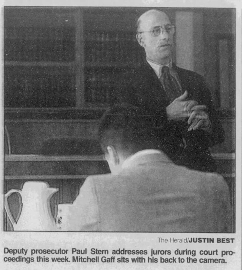 Deputy prosecutor Paul Stern addresses jurors during court proceedings. Mitchell Gaff sits with his back to the camera. This photo originally appeared in The Everett Daily Herald on Aug. 19, 2000. (Justin Best / The Herald file)