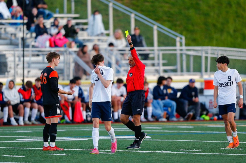 Monroes Trent Skurdal is called for a yellow card during a 3A District soccer match against Everett on Thursday, May 2, 2024, at Monroe High School in Monroe, Washington. (Ryan Berry / The Herald)