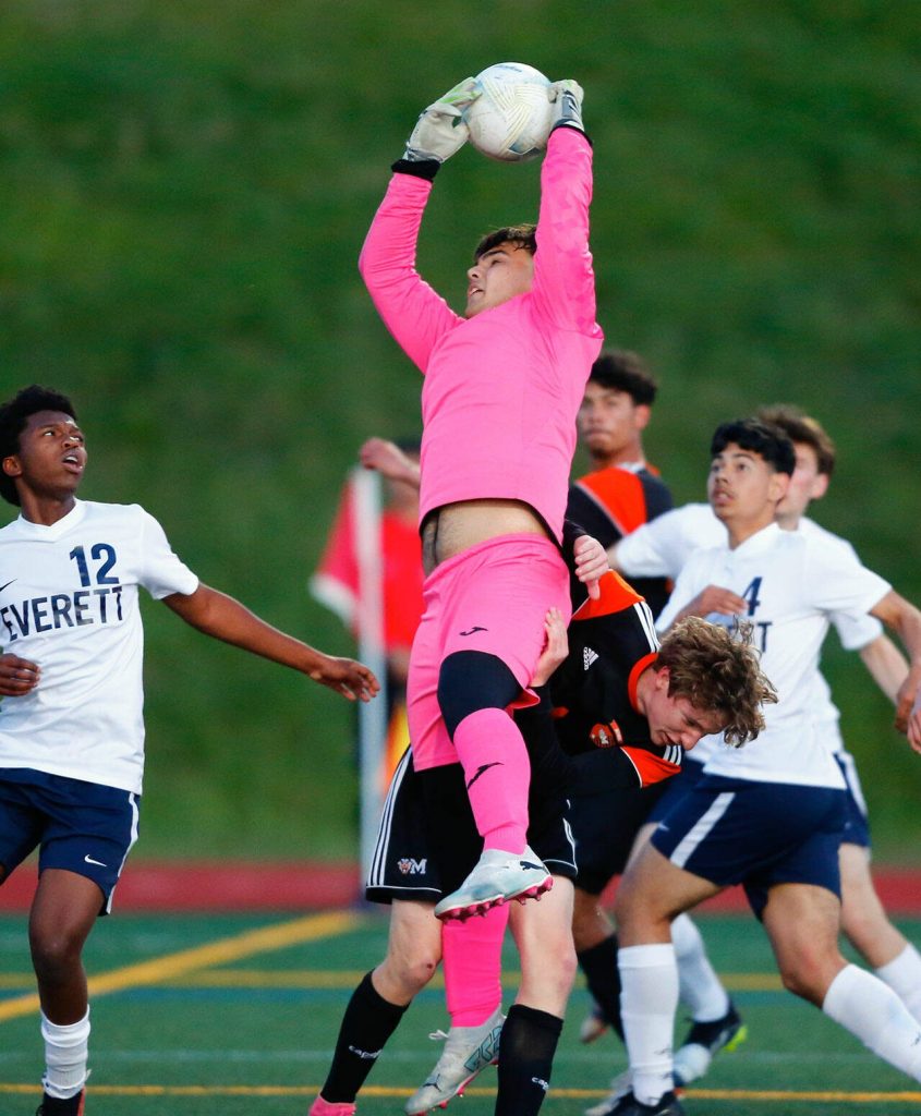Everett goalkeeper Tristan Slater comes down with a set piece during a 3A District soccer match against Monroe on Thursday, May 2, 2024, at Monroe High School in Monroe, Washington. (Ryan Berry / The Herald)
