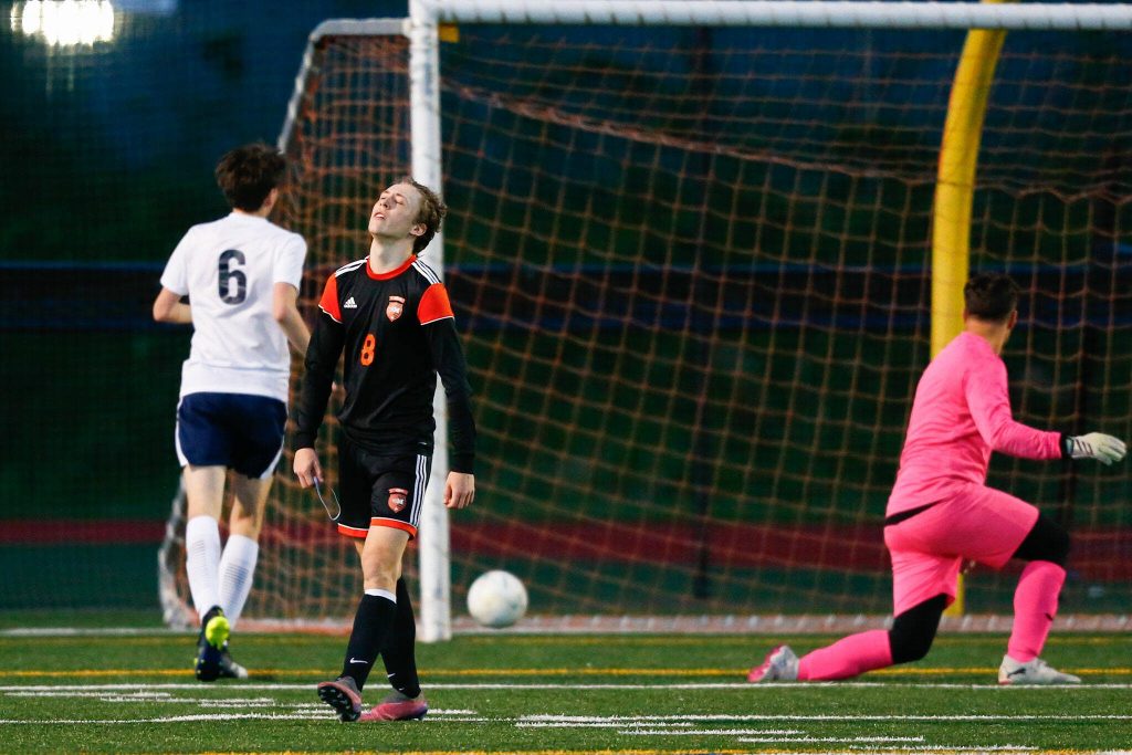 Monroes Tanner Summers reacts with disgust after narrowly missing a goal during a 3A District soccer match against Everett on Thursday, May 2, 2024, at Monroe High School in Monroe, Washington. (Ryan Berry / The Herald)
