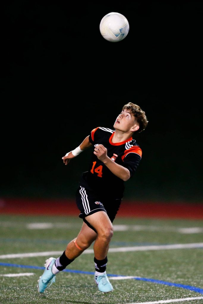 Monroes Cody Duncan chases down a loose ball over his head during a 3A District soccer match against Everett on Thursday, May 2, 2024, at Monroe High School in Monroe, Washington. (Ryan Berry / The Herald)