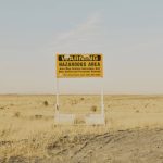 A radiation warning sign along a road near the Hanford Site in Washington state, on Aug. 10, 2022. Hanford, the largest and most contaminated of all American nuclear weapons production sites, is too polluted to ever be returned to public use. Cleanup efforts are now at an inflection point. (Mason Trinca / New York Times file photo)