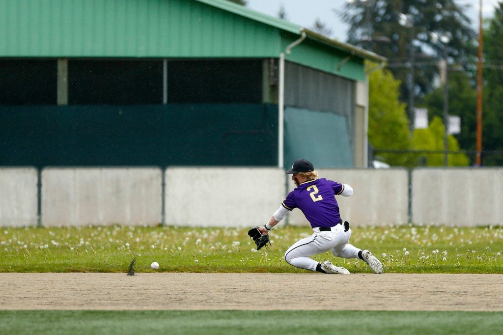 Lake Stevens shortstop Aspen Alexander nearly makes a sliding play in the field during a playoff loss to Bothell on Saturday, May 4, 2024, in Lake Stevens, Washington. (Ryan Berry / The Herald)