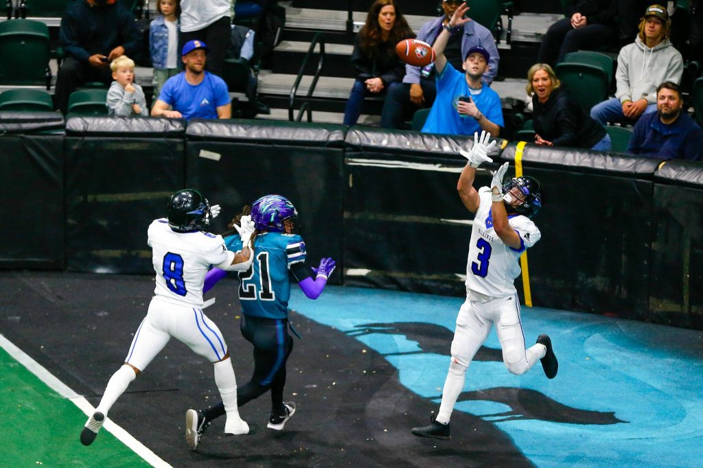 Outlaws defensive back Duane Brown intercepts a pass in the end zone during the Washington Wolfpacks inaugural home opener against Billings on Sunday, May 5, 2024, a Angel of the Winds Arena in Everett, Washington. (Ryan Berry / The Herald)