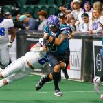 Quarterback Jacob Taase gets tackled during the Washington Wolfpacks inaugural home opener against Billings on Sunday, May 5, 2024, a Angel of the Winds Arena in Everett, Washington. (Ryan Berry / The Herald)