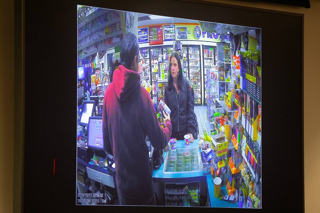 Surveillance footage showing Shawna Brune at a convenience store the night of her death is displayed during opening statements in the new trial of Jamel Alexander on Tuesday, April 16, 2024, at Snohomish County Superior Court in Everett, Washington. (Ryan Berry / The Herald)