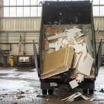A truck dumps sheet rock onto the floor at Airport Road Recycling & Transfer Station on Thursday, Nov. 30, 2023 in Everett, Washington. (Olivia Vanni / The Herald)