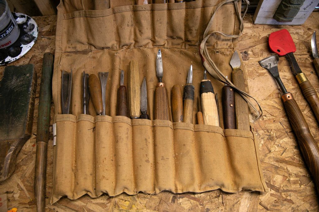 A bag of carving tools lays on a workbench in Fred Fulmers shed on Wednesday, May 8, 2024, at his home in Everett, Washington. (Ryan Berry / The Herald)