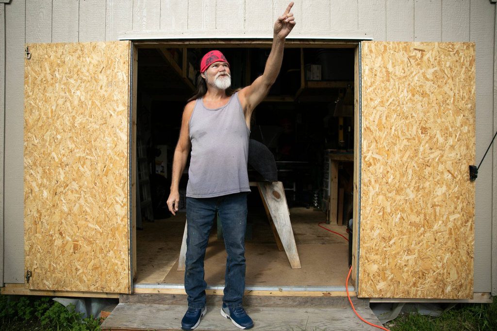 Fred Fulmer describes an encounter he and his wife Ivy had with an eagle earlier in the morning on Wednesday, May 8, 2024, in their backyard in Everett, Washington. (Ryan Berry / The Herald)