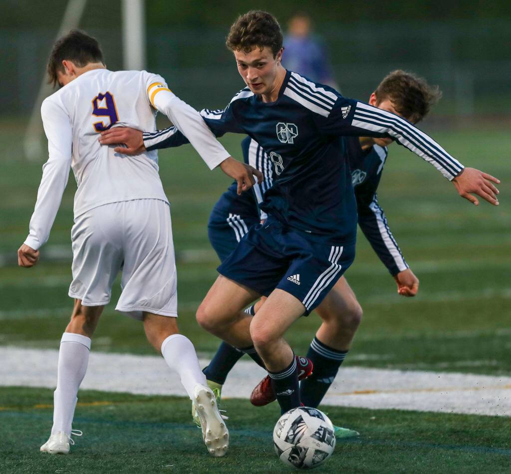 Glacier Peaks Luke Smith (8) fights for the ball during a Class 4A District 1/2 boys soccer game between Glacier Peak and Issaquah at Glacier Peak High School in Snohomish, Washington on Tuesday, May 7, 2024. Issaquah won, 2-1. (Annie Barker / The Herald)