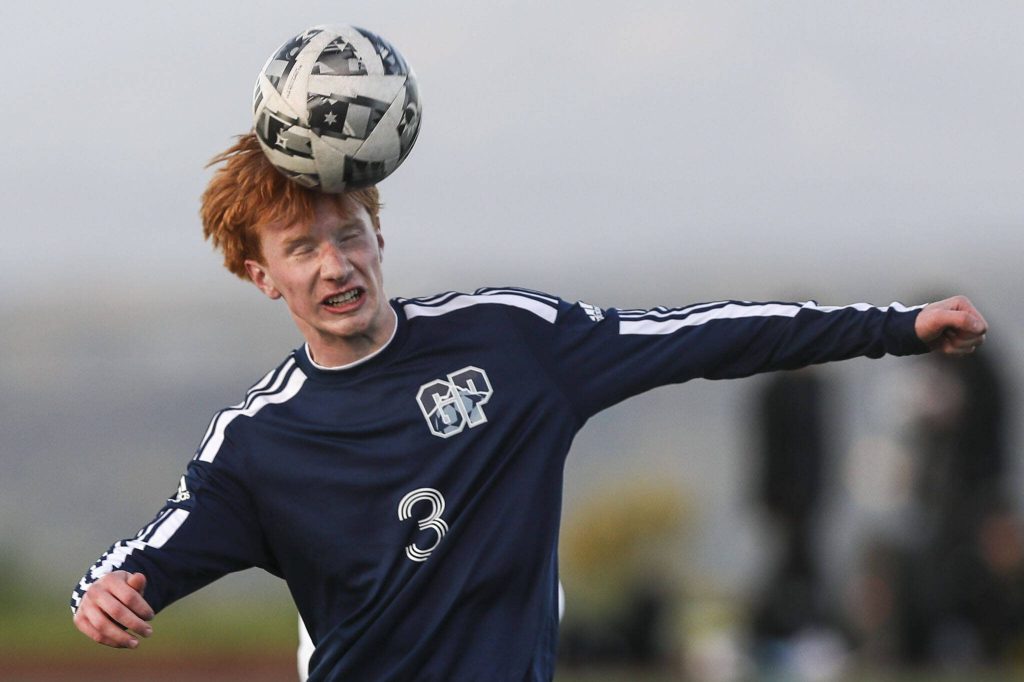 Glacier Peaks Kollin Undseth (3) heads the ball during a Class 4A District 1/2 boys soccer game between Glacier Peak and Issaquah at Glacier Peak High School in Snohomish, Washington on Tuesday, May 7, 2024. Issaquah won, 2-1. (Annie Barker / The Herald)