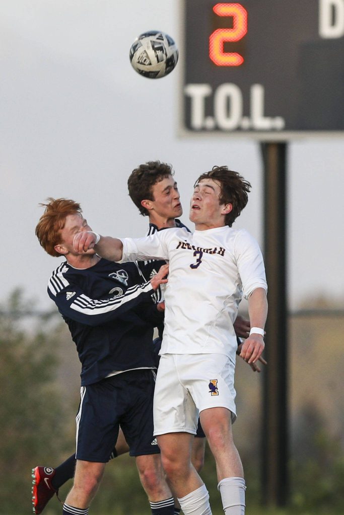 Issaquah and Glacier Peak players fight for the ball during a Class 4A District 1/2 boys soccer game between Glacier Peak and Issaquah at Glacier Peak High School in Snohomish, Washington on Tuesday, May 7, 2024. Issaquah won, 2-1. (Annie Barker / The Herald)