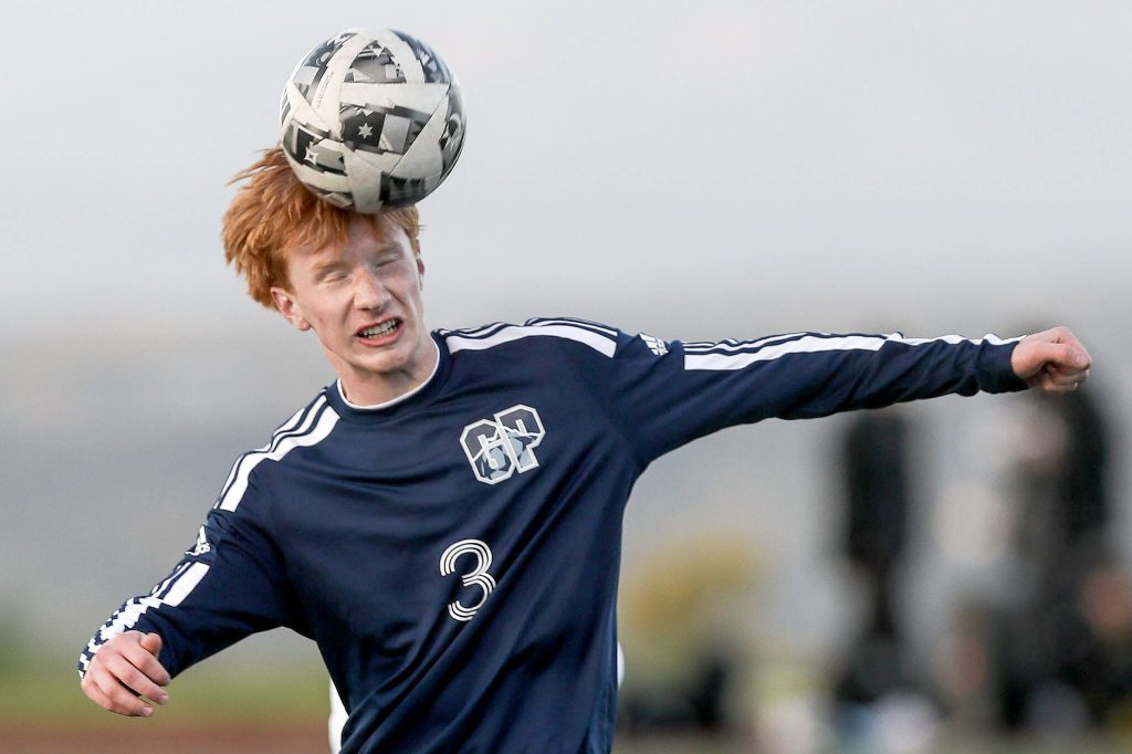 Glacier Peaks Kollin Undseth (3) heads the ball during a Class 4A District 1/2 boys soccer game between Glacier Peak and Issaquah at Glacier Peak High School in Snohomish, Washington on Tuesday, May 7, 2024. Issaquah won, 2-1. (Annie Barker / The Herald)