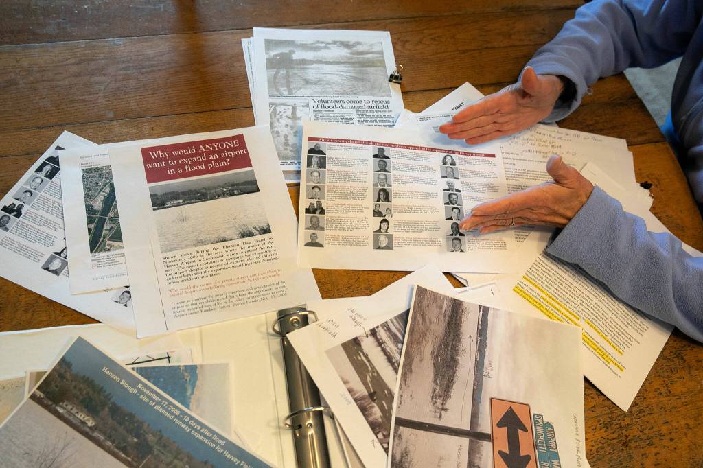 Documents brought together by Barbara Bailey and Beth Jarvis are laid our on Baileys dining table on Monday, May 13, 2024, at Bailey Farm in Snohomish, Washington. (Ryan Berry / The Herald)