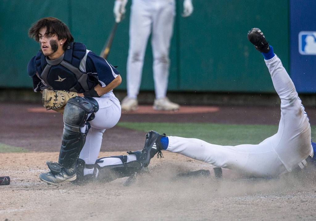 Glacier Peaks Lucas Entler gets an out at home during the 4A district game against Bothell at Funko Field on Thursday, May 9, 2024 in Everett, Washington. (Olivia Vanni / The Herald)
