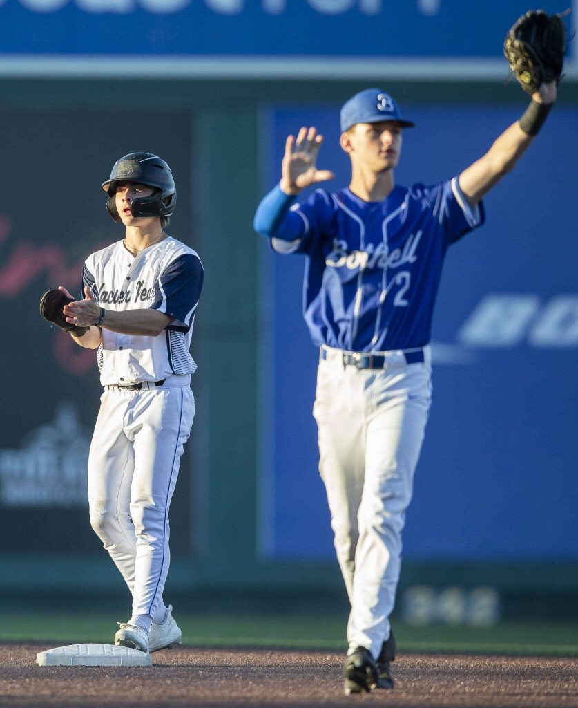 Glacier Peaks Landon Whitaker claps after making it to second base during the 4A district game against Bothell at Funko Field on Thursday, May 9, 2024 in Everett, Washington. (Olivia Vanni / The Herald)