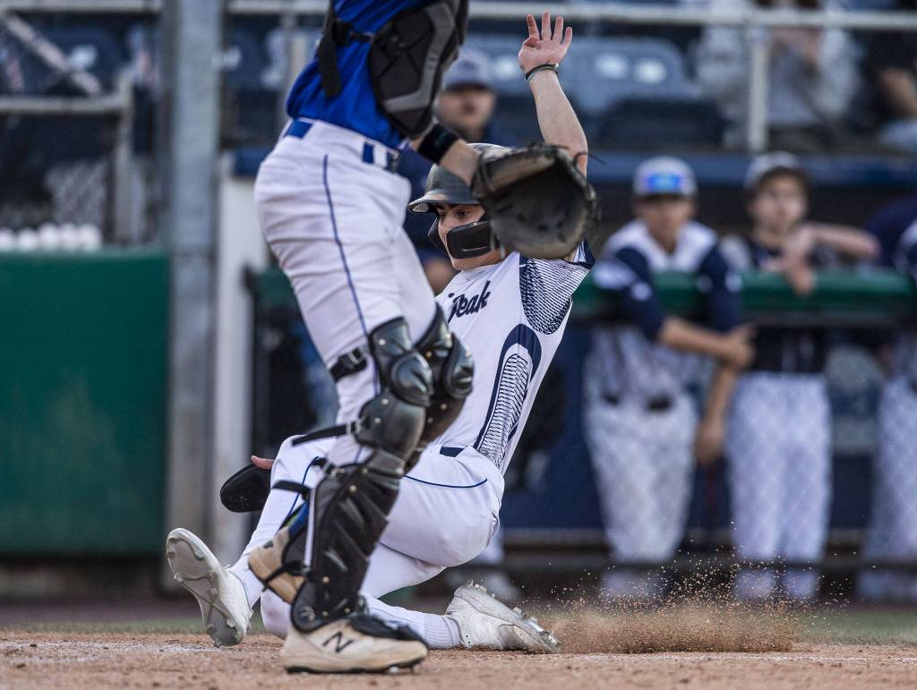 Glacier Peaks Landon Whitaker slides into home during the 4A district game against Bothell at Funko Field on Thursday, May 9, 2024 in Everett, Washington. (Olivia Vanni / The Herald)