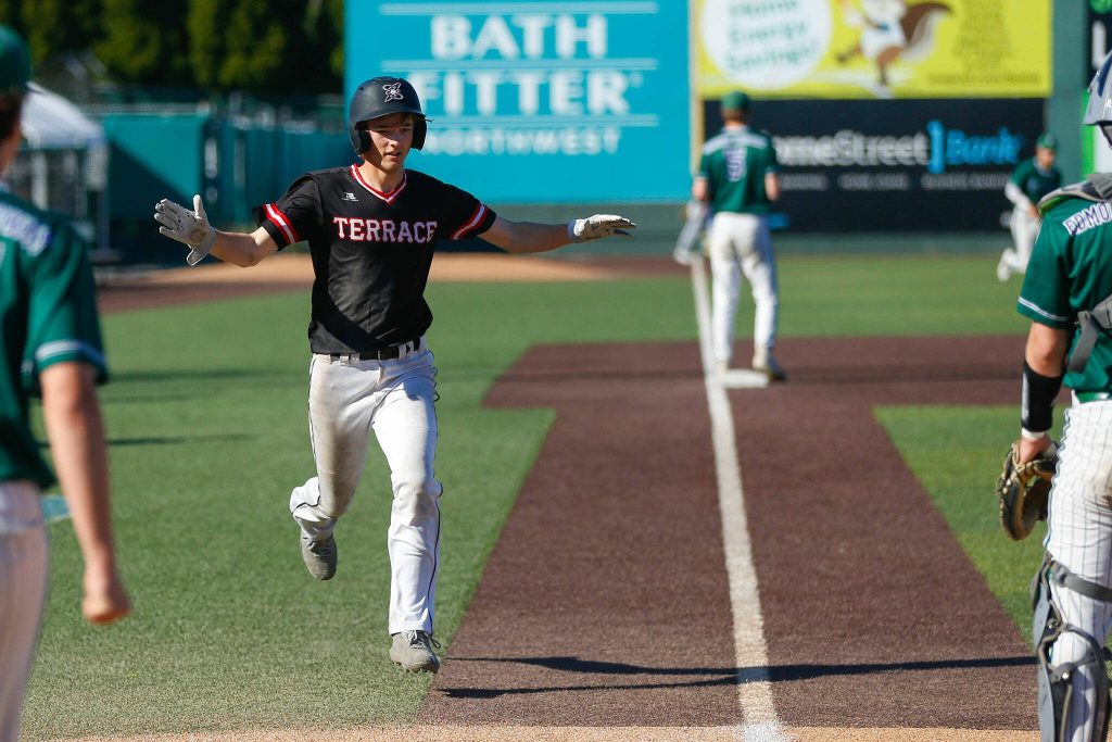 Mountlake Terrace senior Ryan Sturgill scores from third on a hit against Edmonds-Woodway in the Class 3A District 1 baseball championship Saturday, May 11, 2024, at Funko Field in Everett, Washington. (Ryan Berry / The Herald)