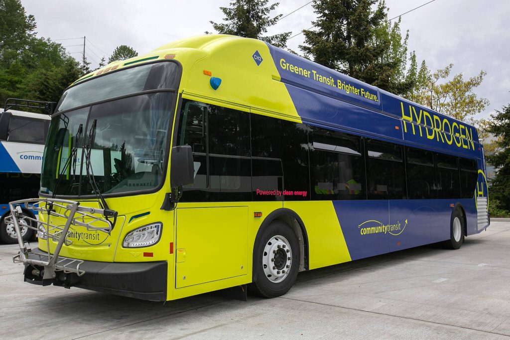 Community Transits new hydrogen-powered bus is parked alongside other older, diesel-fueled buses Monday, May 13, 2024, at the Community Transit Operations Base in Everett, Washington. (Ryan Berry / The Herald)