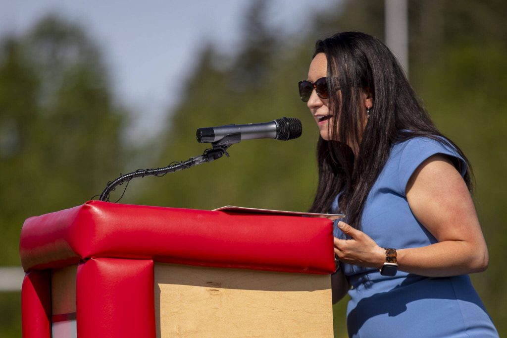 Principal Alicia Mitchell speaks during a ceremony for the healing pole students spent the last year carving along with Tulalip carver James Madison at Archbishop Murphy High School in Everett, Washington on Wednesday, May 15, 2024. (Annie Barker / The Herald)