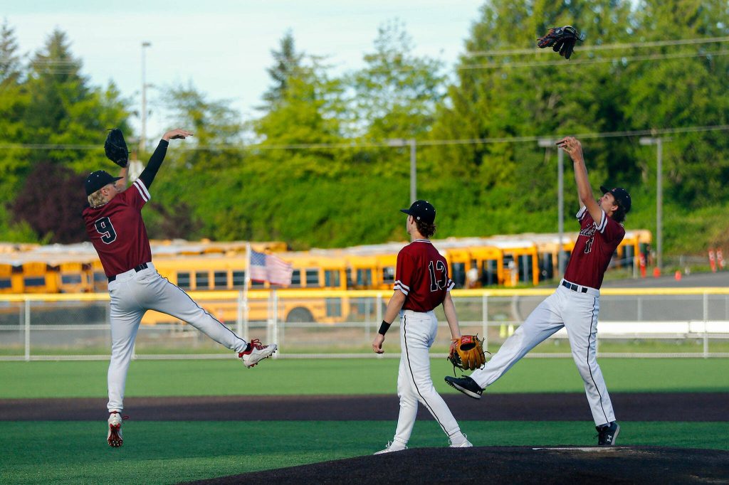 Kentlake players celebrate the final out of a win over Stanwood on Tuesday, May 14, 2024, at Kent Meridian High School in Kent, Washington. (Ryan Berry / The Herald)