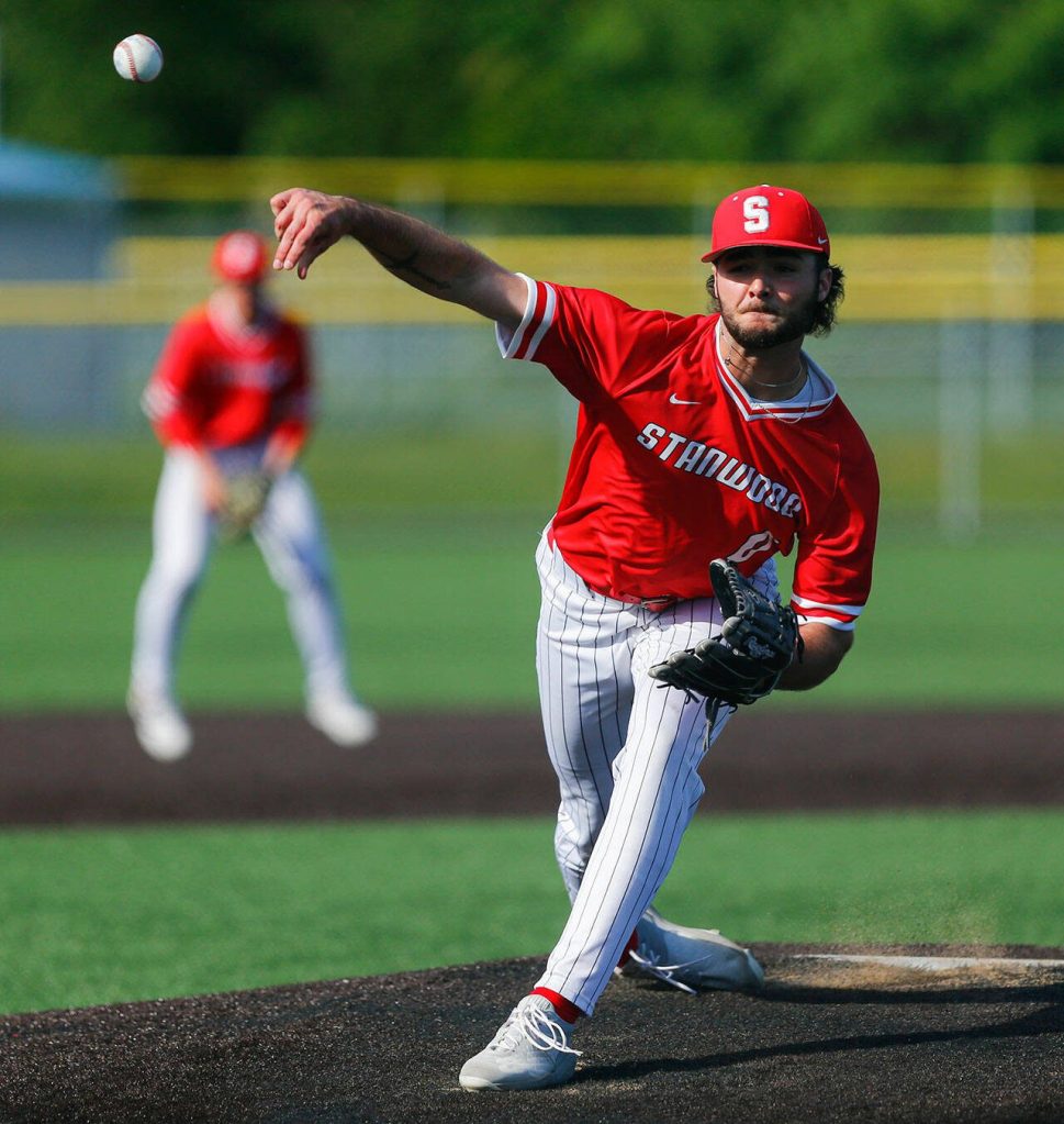 Stanwood senior Ryan Cheeseman pitches in the first inning of a playoff loss to Kentlake on Tuesday, May 14, 2024, at Kent Meridian High School in Kent, Washington. (Ryan Berry / The Herald)