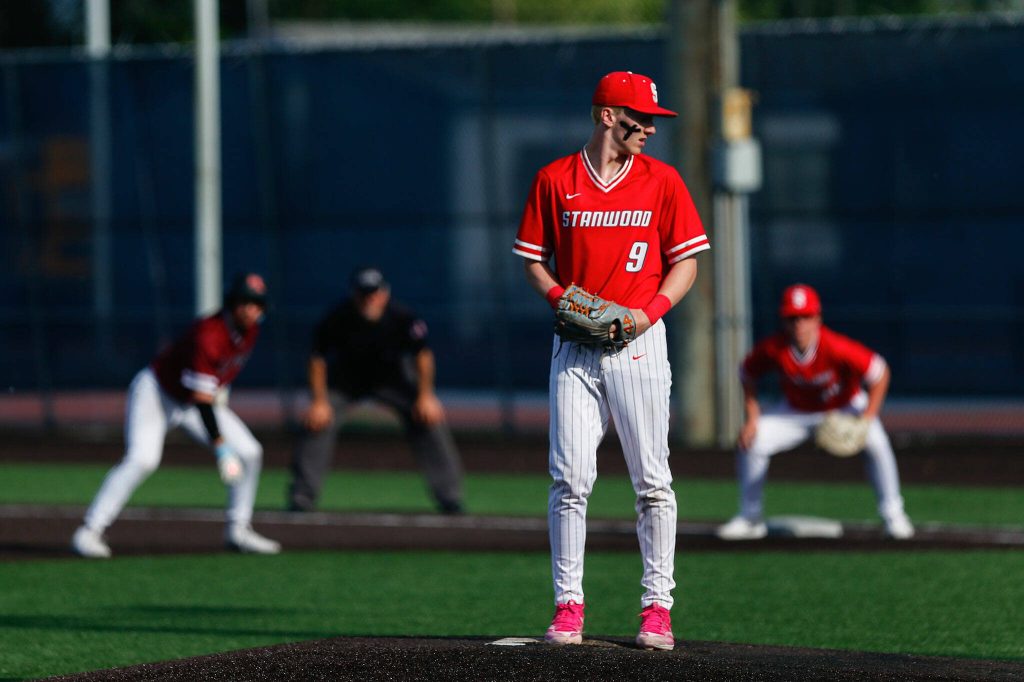 Stanwoods TJ McQuery works with a man on first during a playoff loss to Kentlake on Tuesday, May 14, 2024, at Kent Meridian High School in Kent, Washington. (Ryan Berry / The Herald)