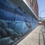 A mural by Gina Ribaudo at the intersection of Colby and Pacific for the Imagine Childrens Museum in Everett, Washington on Thursday, May 9, 2024. (Annie Barker / The Herald)