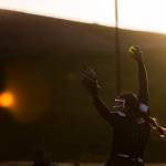 The sun illuminates Jacksons Yanina Sherwood as she pitches during the 4A district championship against Kamiak on Friday, May 17, 2024 in Everett, Washington. (Olivia Vanni / The Herald)