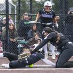 Kamiaks Emma Stansfield slides into home to score after the ball misses the glove of Jacksons Yanina Sherwood during the 4A district championship on Friday, May 17, 2024 in Everett, Washington. (Olivia Vanni / The Herald)