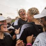 Jacksons Yanina Sherwood smiles and hugs her teammates after beating Kamiak to win the 4A district championship on Friday, May 17, 2024 in Everett, Washington. (Olivia Vanni / The Herald)