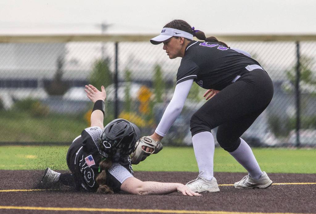 Kamiaks Aliya Boonsripisal tags out Jacksons Hailey Pelletier as she slides into second base during the 4A district championship on Friday, May 17, 2024 in Everett, Washington. (Olivia Vanni / The Herald)