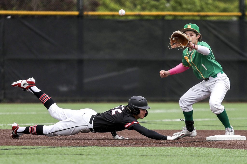 Mountlake Terraces Robert Swan (12) slides back to second during a baseball game between Mountlake Terrace and Bishop Blanchet and at Edmonds-Woodway High School in Edmonds, Washington on Saturday, May 18, 2024. Mountlake Terrace won, 12-7.(Annie Barker / The Herald)