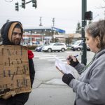 Catholic Community Services NW Director of Housing Services and Everett Family Center Director Rita Jo Case, right, speaks to a man who asked to remain anonymous, left, during a point-in-time count of people facing homelessness in Everett, Washington on Tuesday, Jan. 24, 2023. (Annie Barker / The Herald)