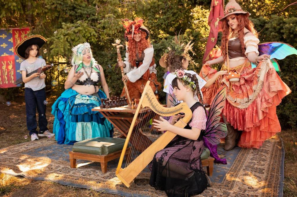 Whidbey Renaissance Faire volunteers pose in their costumes. (Photo by Bree Eaton)