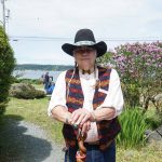Storyteller Lou LaBombard stands before the Island County Historical Museum on Saturday. (Photo by Sam Fletcher)